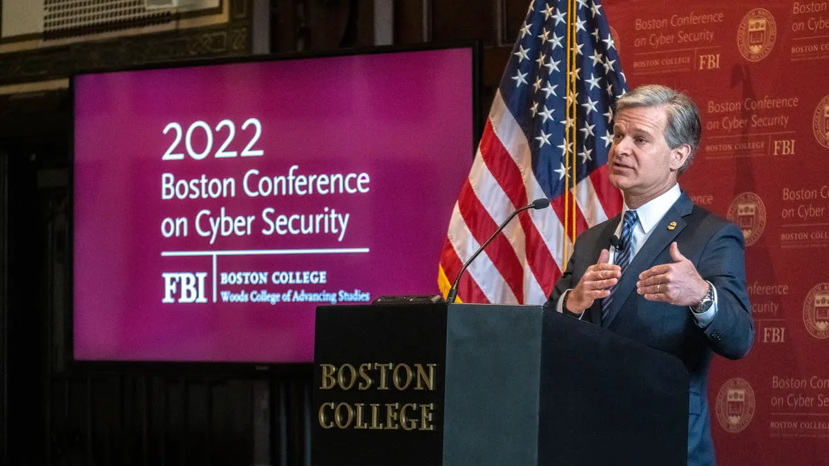 FBI Director Christopher Ray speaking at the annual Boston Conference on Cyber Security