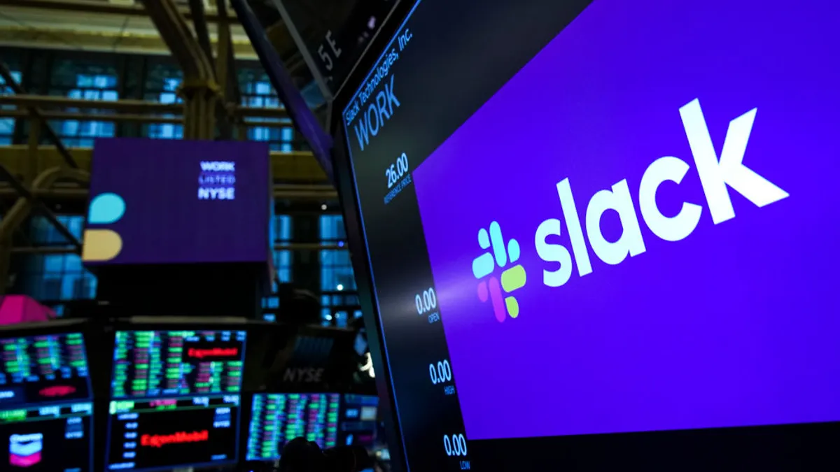 A screen with the Slack logo on the trading floor of the New York Stock Exchange.