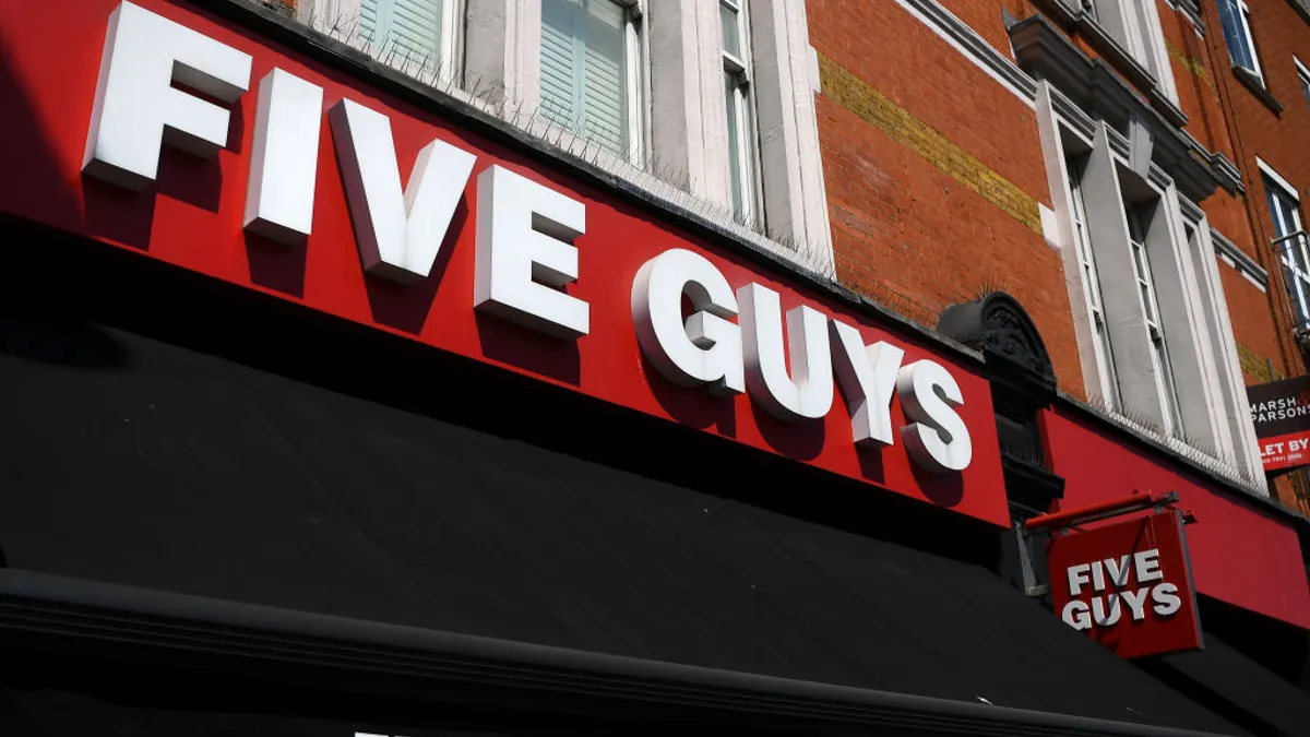 A Five Guys restaurant is pictured in London, England on May 7, 2020. The company confirmed a data breach last September in a series of consumer notification letters issued Dec. 29, 2022.