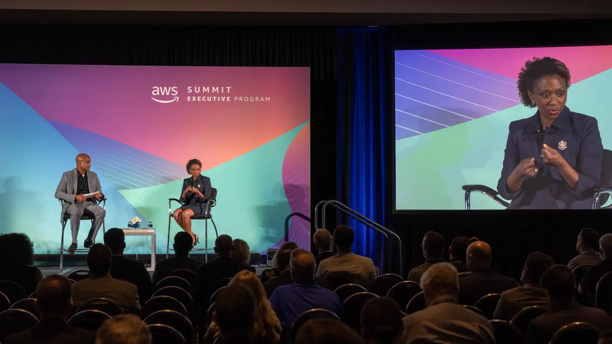 Kemba Walden, acting national cyber director, speaks with David Levy, VP, government, nonprofit and healthcare at AWS, during a fireside chat at the AWS Summit with David