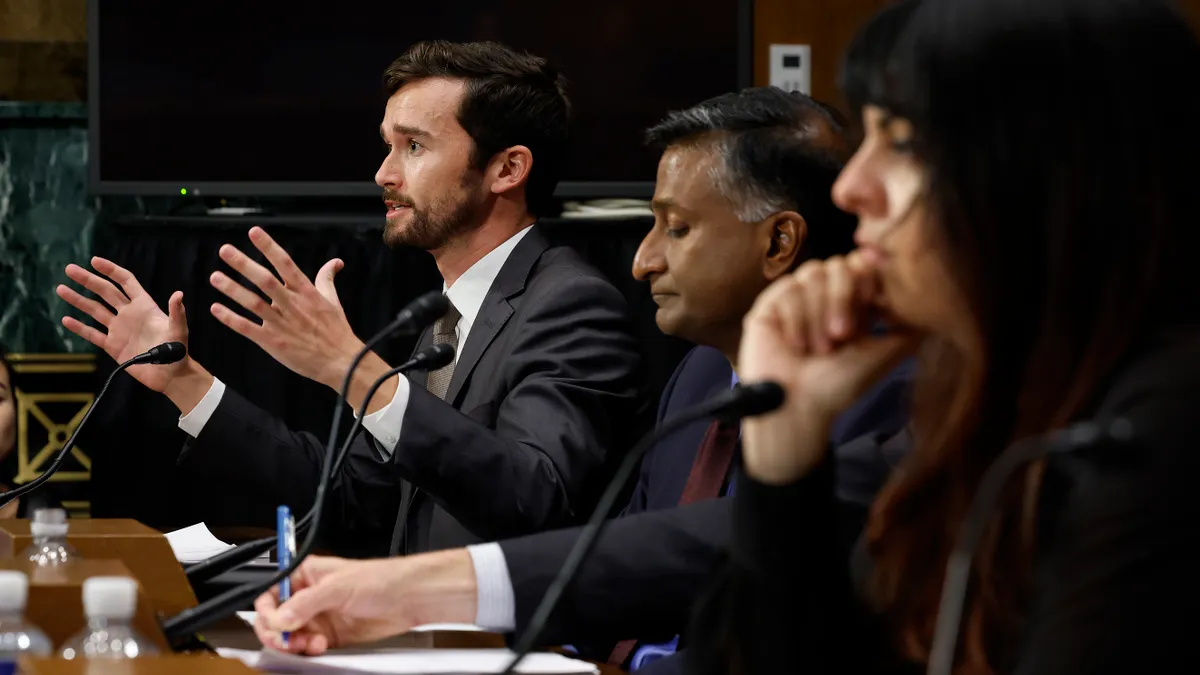 Head of Public Policy at Stability AI Ben Brooks (L) testifies with others before the Senate Judiciary Committee's Intellectual Property Subcommittee about artificial intelligence and copyright in the